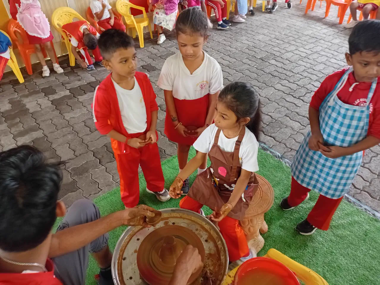 Children learning pottery with Ram Pottery Mauritius
